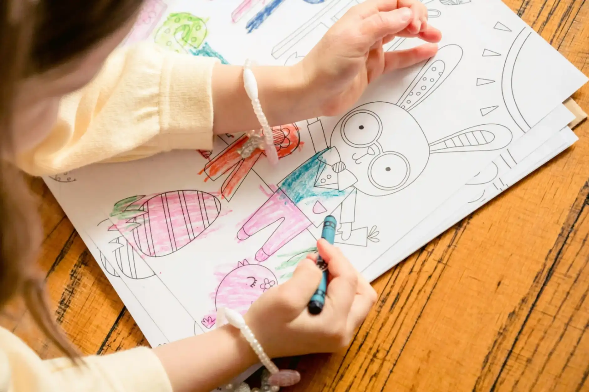 kid coloring a page