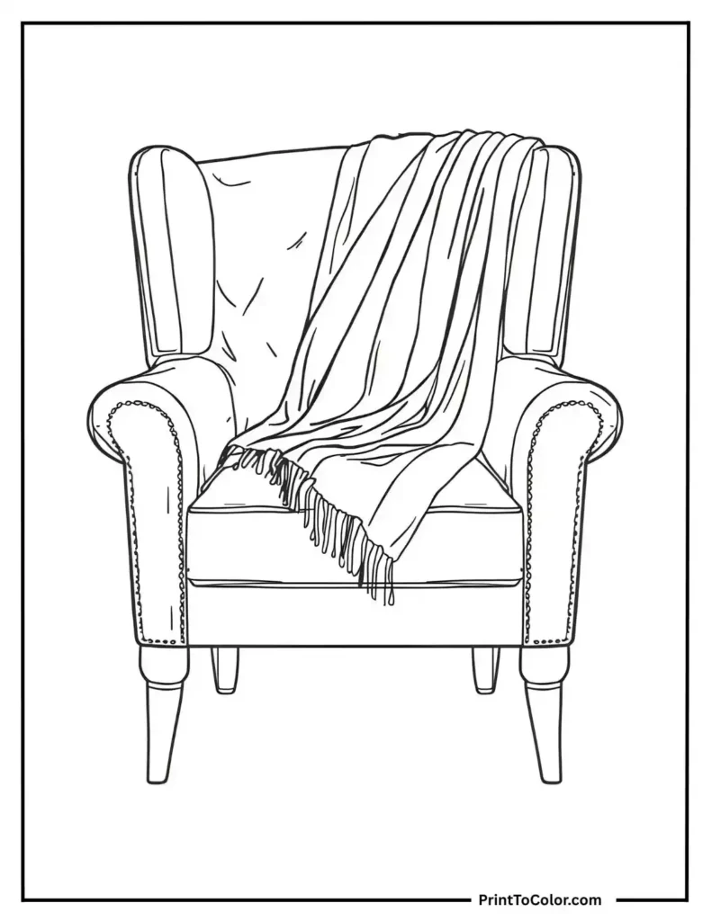 cozy armchair with a folded blanket on it